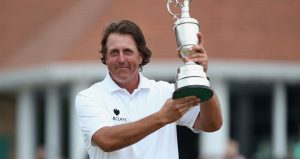 Phil Mickelson lifts the Claret Jug in 2013, at Muirfiled.